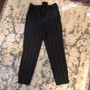 High-waisted navy pinstriped trousers, size 6